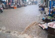 An hour of heavy rain turned roads into streams in Gopeshwar; water entered hotels and shops.