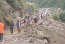 Road on Badrinath Highway destroyed by massive falling boulder; travel resumed after eight hours.