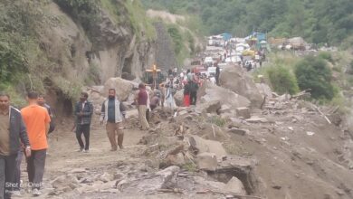 Road on Badrinath Highway destroyed by massive falling boulder; travel resumed after eight hours.