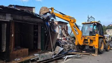 Major crackdown on unauthorized construction in Mussoorie; four shops demolished using a JCB.