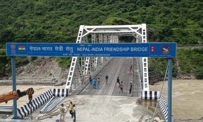 Dispute over welcome board at India-Nepal bridge; name of Indian village removed.